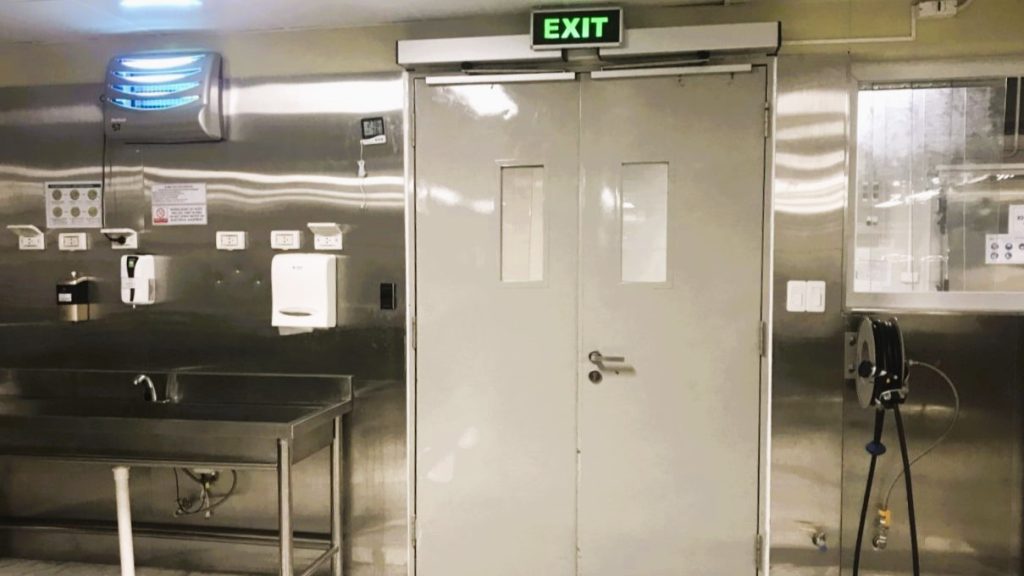 NABCO automatic swing door at the entrance to the hotel kitchen area